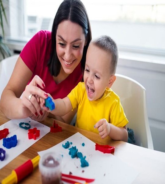 mother-helping-child-with-sensory-processing-disorder-using-occupational-therapy-techniques-at-home (1)